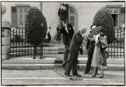 Formally dressed people greeting each other, Brussels, Belgium