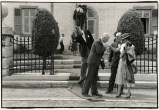 Formally dressed people greeting each other, Brussels, Belgium