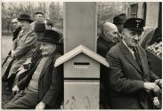 Retired men sitting in a park, Leipzig, E. Germany