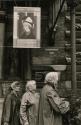 Three women dressed for the rain in front of Rijksmuseum, Amsterdam, Holland