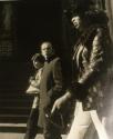 Three people walking by St. Thomas Episcopal Church